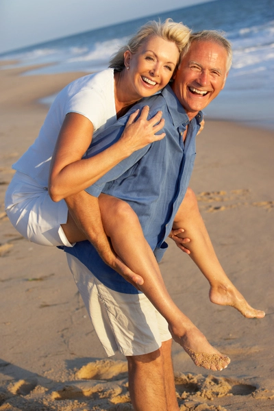 Margaritaville - Section Column Images - Happy elderly couple on the beach Margaritaville - Section Column Images - Happy elderly couple on the beach