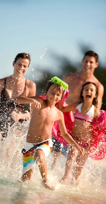 Margaritaville - Section Column Images - family-running-beach-water-swimwear-3 Margaritaville - Section Column Images - family-running-beach-water-swimwear-3