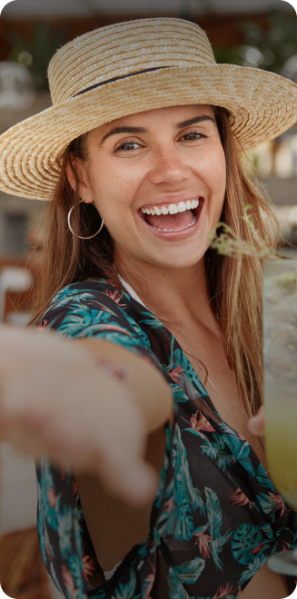 Margaritaville - Section Columns Images - woman smiling at the beach Margaritaville - Section Columns Images - woman smiling at the beach