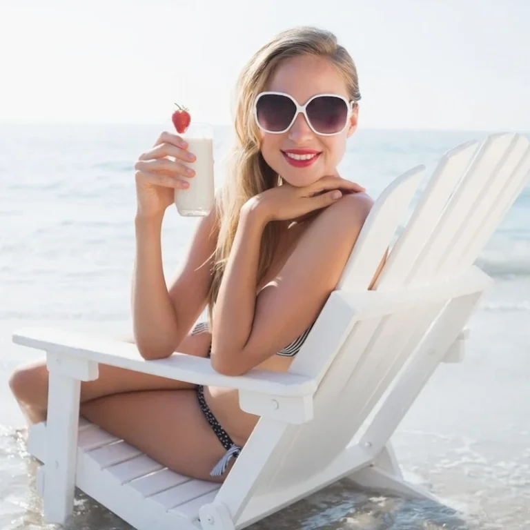 Woman-enjoying-the-beach-with-a-drink-768x768 The Tides