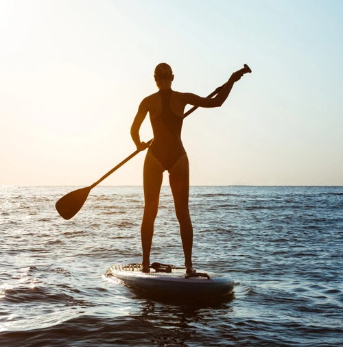 beachwalk-amenities-woman-paddling-at-the-beach Beachwalk